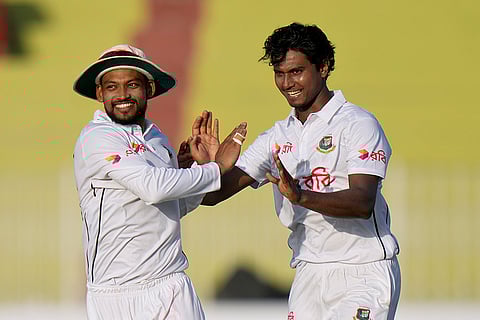 Pakistan vs Bangladesh 1st Test Day 1: Bangladesh's Hasan Mahmud, right, celebrates with teammate Najmul Hossain Shanto